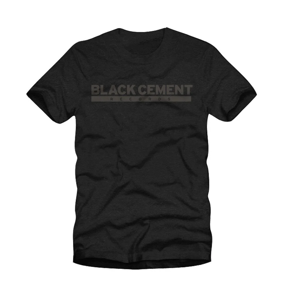Black Cement Logo Tee in Heather Black Bella Canvas